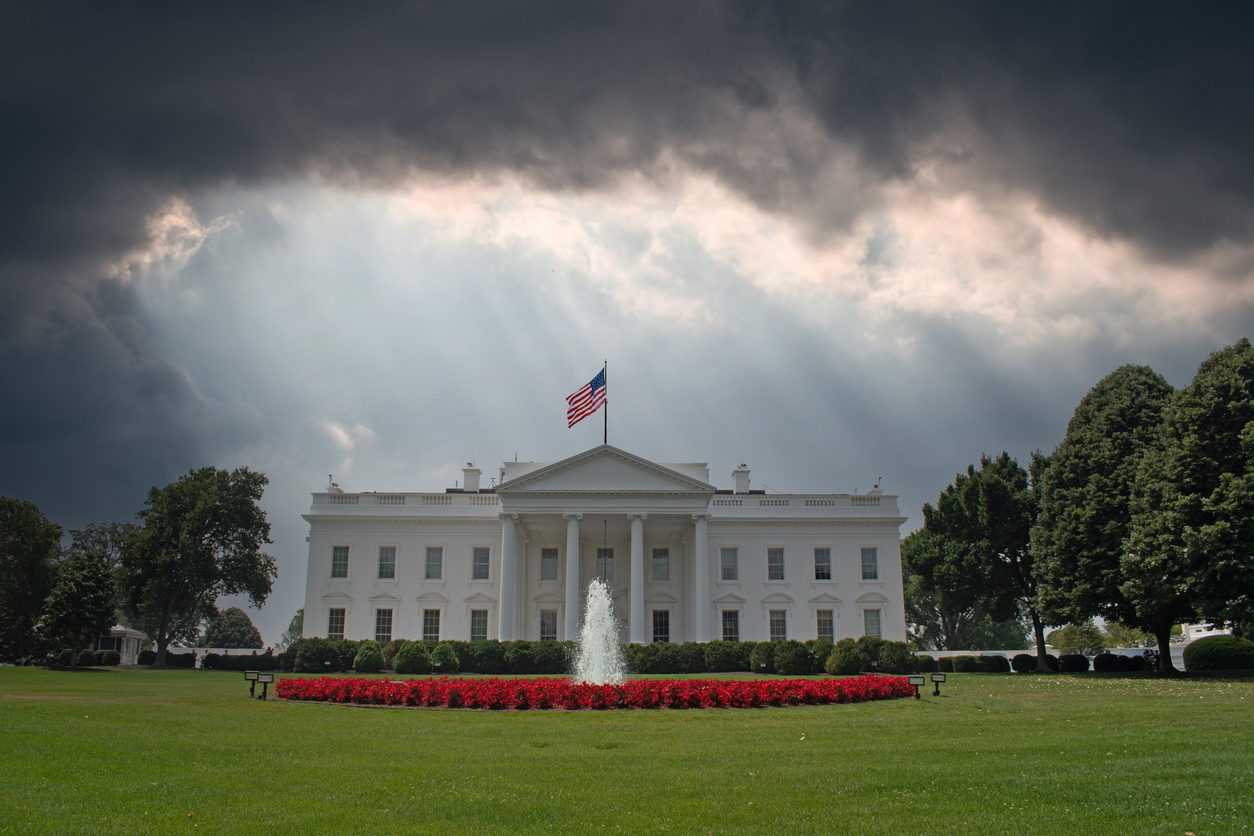 The White House with a dark cloudy sky