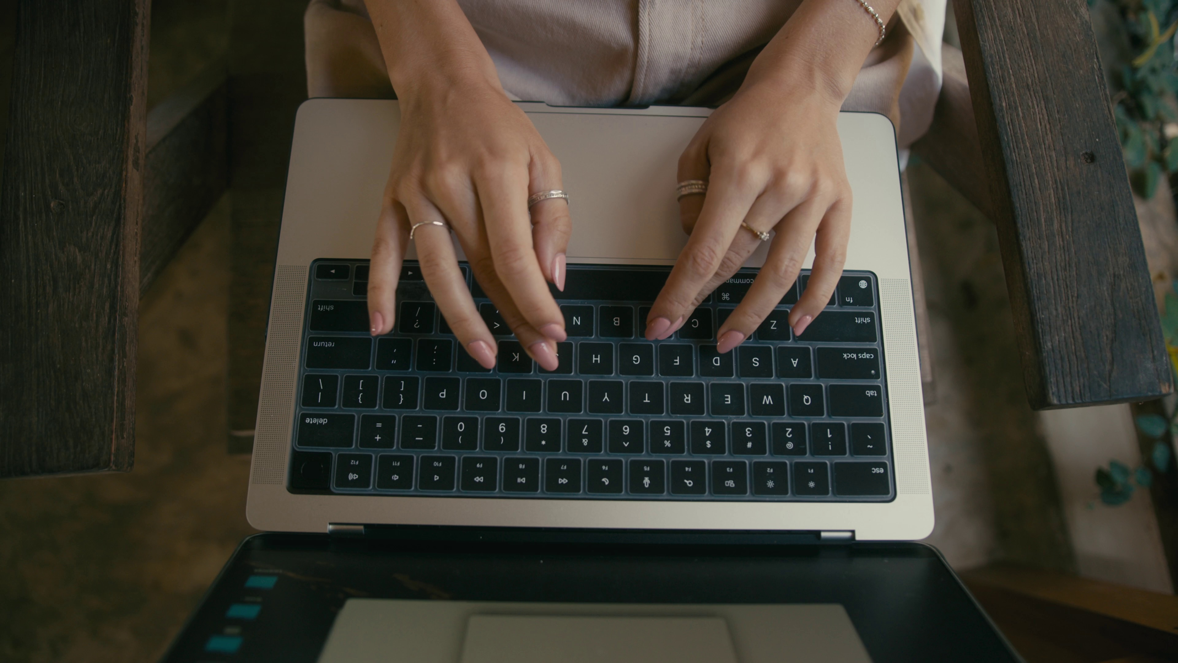 female hands typing on a laptop