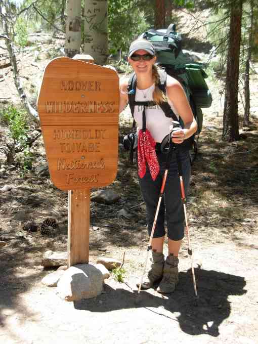 Pamela Flick at sign for new boundary of Hoover Wilderness