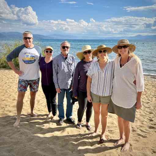 Four members of Defenders' California team plus two consultants (Andy Johnson, Ashley Overhouse, Jeff Aardahl, Kate Kelly, Kim Delfino, Pam Flick) stand on a beach for a group photo during their program retreat in September 2023.