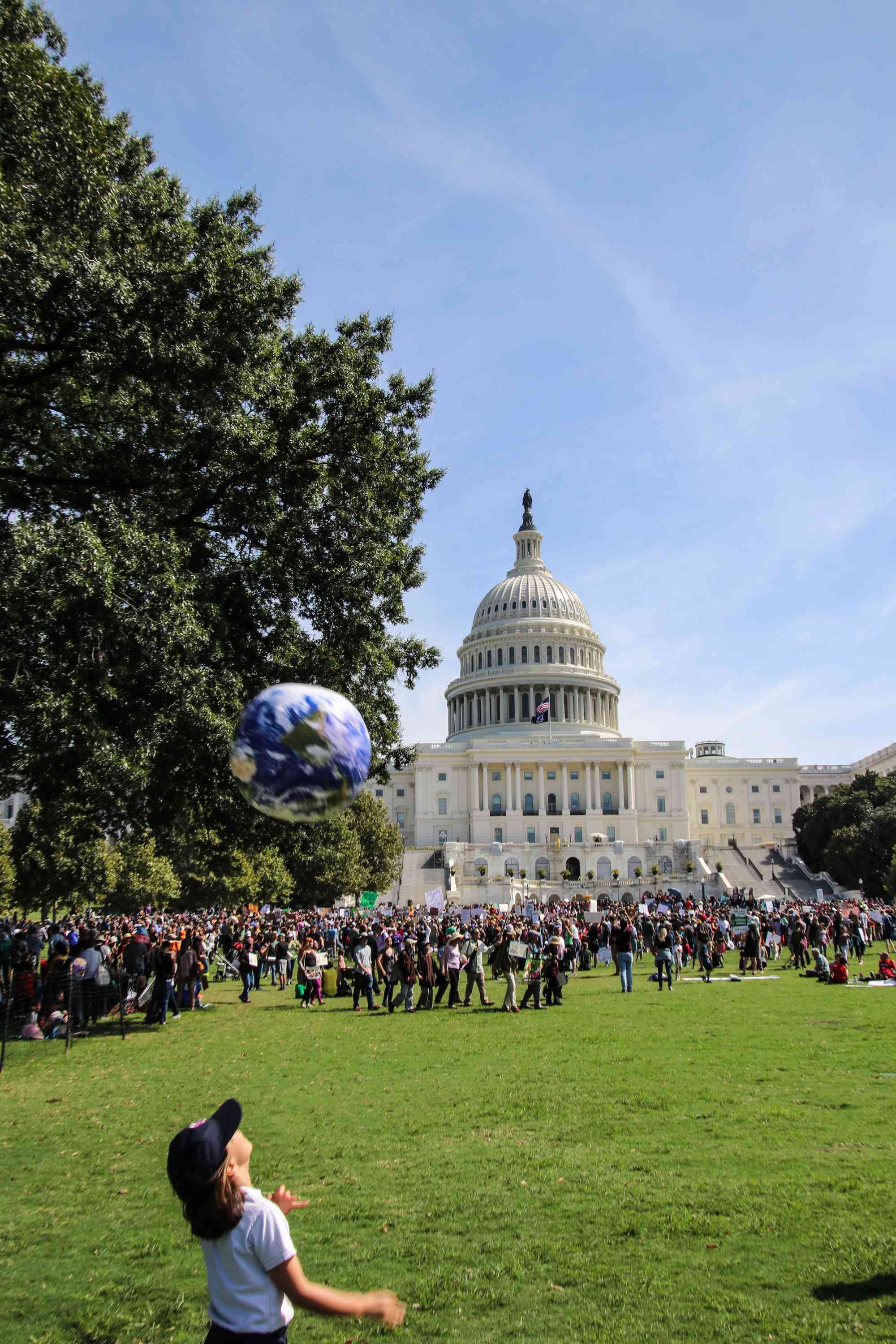 Climate Strike DC - Kid with globe Capitol Lawn
