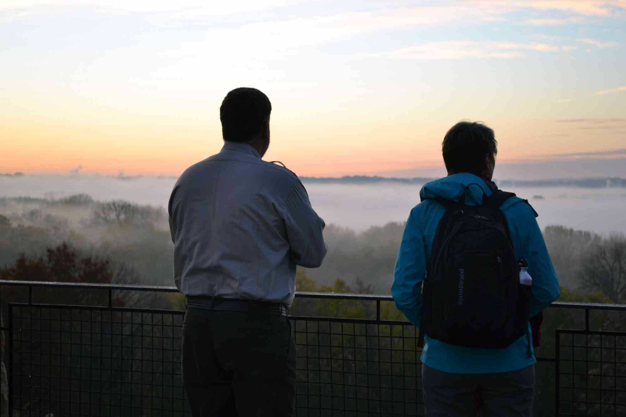 Refuge Manager Tim Bodeen takes in the sunrise with Secretary Sally Jewell at Minnesota Valley National Wildlife Refuge 