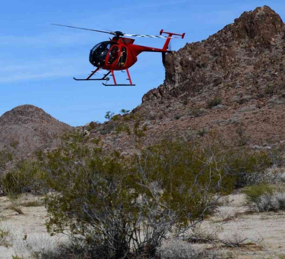 California Department of Fish and Wildlife’s contracted Helicopter Bighorn Capture Crew in a 2018 flight at the Marble Mountains of the California Desert.