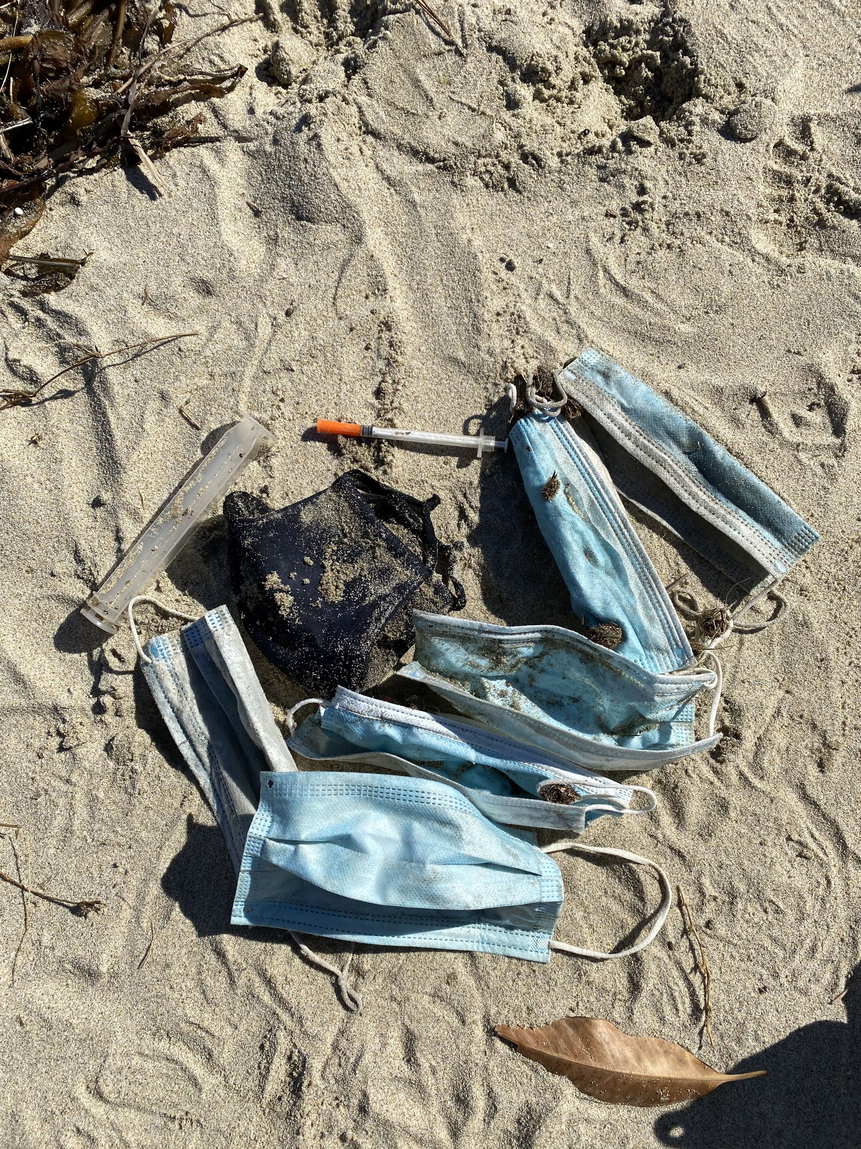 ppe masks on beach