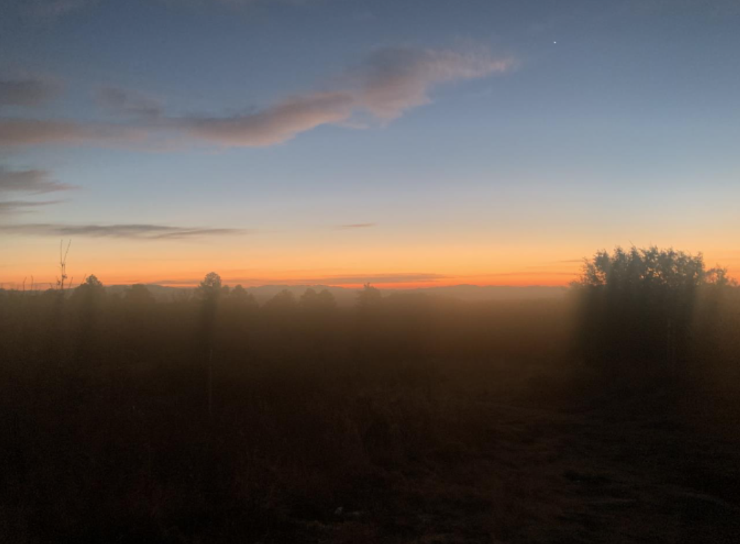 Sunrise over hills from campground