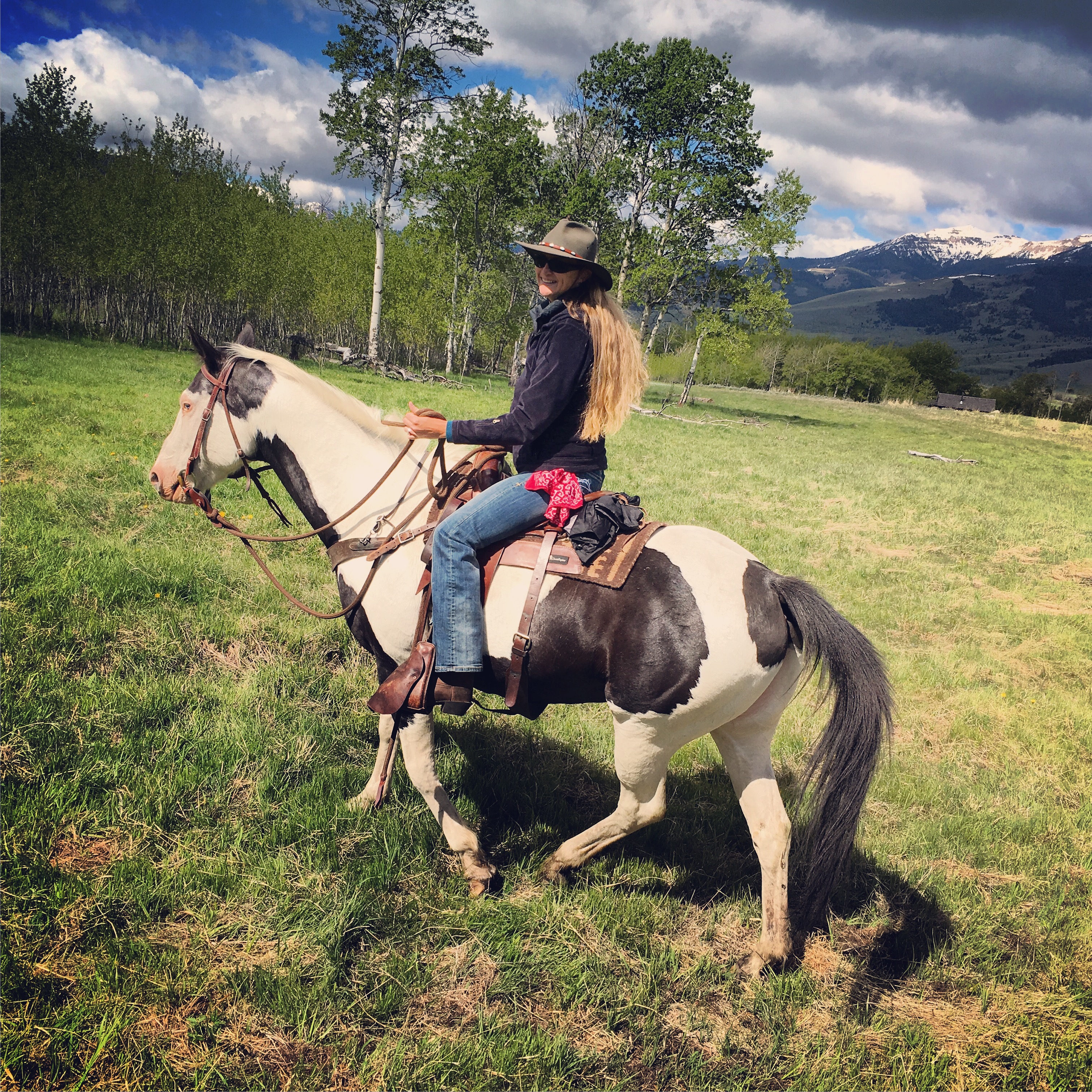 Pam riding horse during range rider workshop