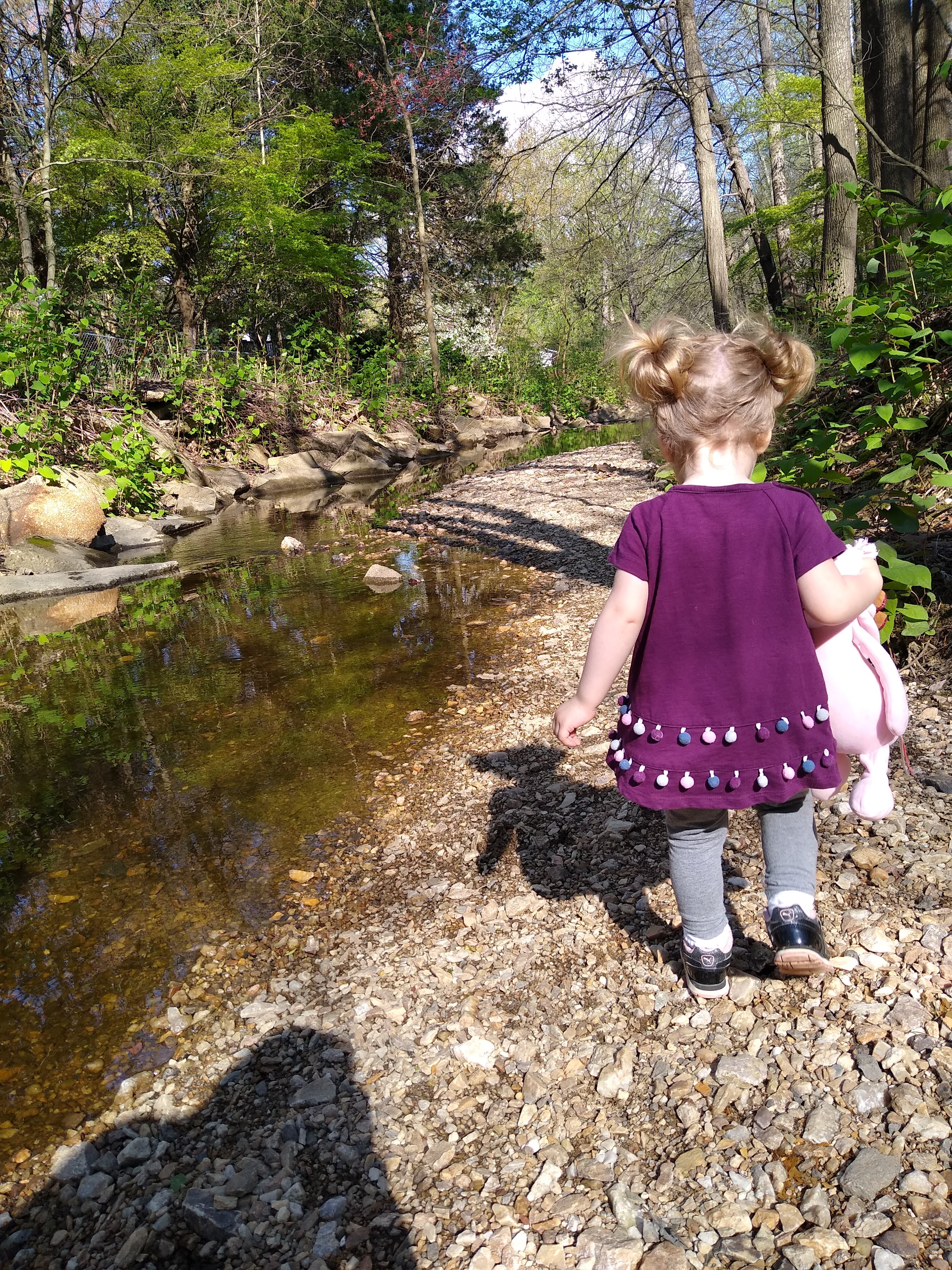 Girl walking through woods